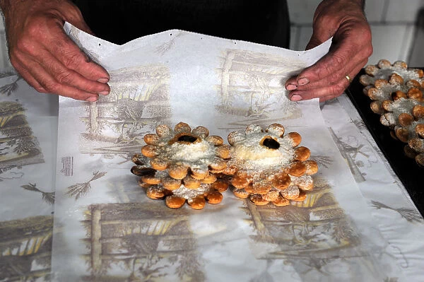 Baker Juan Olives bakes bread in olive wood burning oven