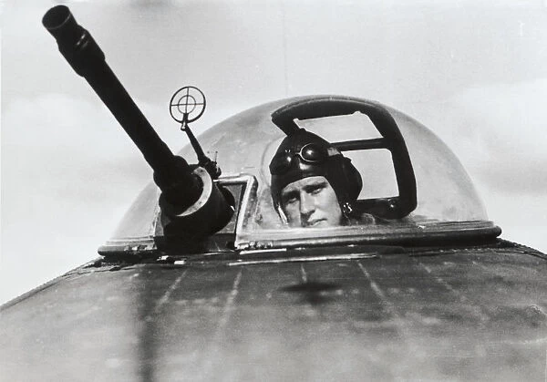A Luftwaffe Air Gunner Sits in His Turret