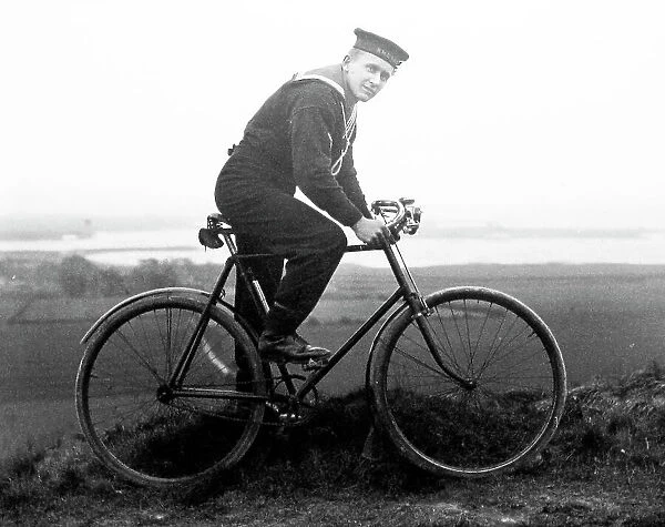 Sailor on his bicycle on shore leave Royal Navy Portsmouth