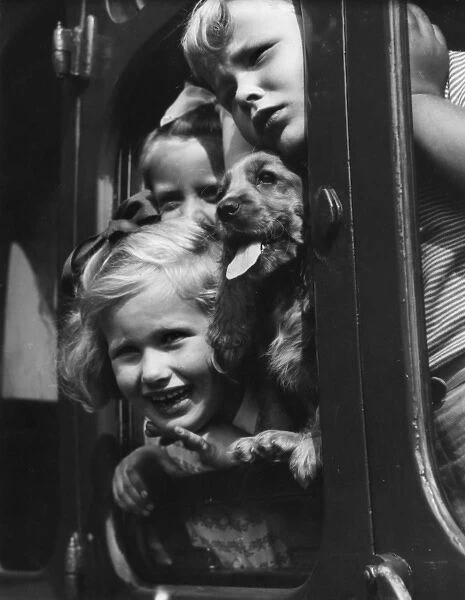 Susi in a train with three children