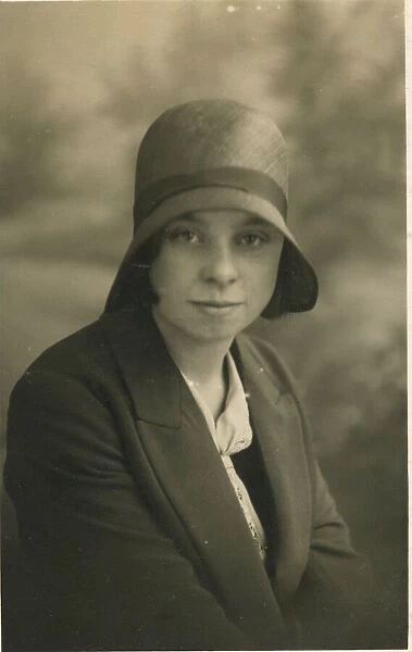 A young woman, called Lily Hughes, photographed in a cloche hat. Date: c. 1928