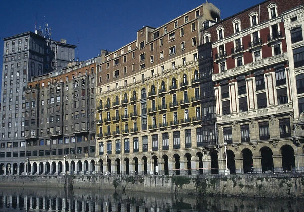 20079961. SPAIN Basque Country Bilbao Riverside arcade with flats and offices