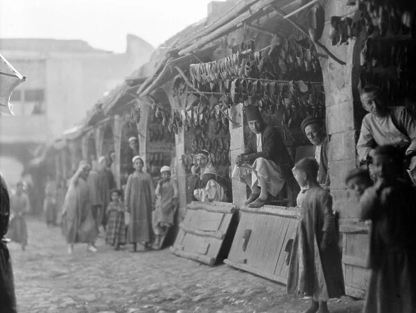 BAGHDAD: MARKET, 1932. Shoe sellers at a market in Baghdad, Iraq, 1932