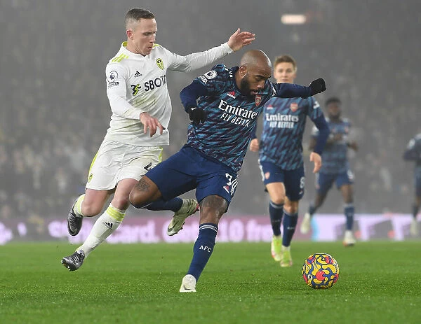 Leeds United vs. Arsenal: Lacazette Clashes with Forshaw in Premier League Showdown