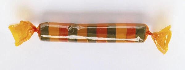 Packet of colourful, round sweets wrapped in clear cellophane