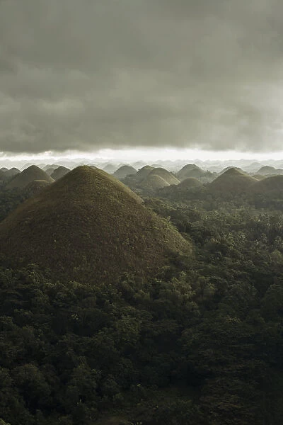 Chocolate hills landscape from Bohol Island, a big storm covers the sky making an interesting lighting effect