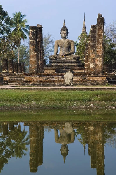 Reflection of buddha statue in pond, Thailand