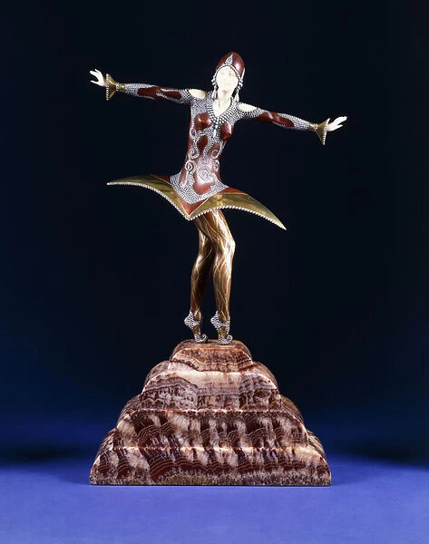 Kora, a figure of an exotic dancer, (gilt, cold-painted bronze and ivory on red marble plinth)