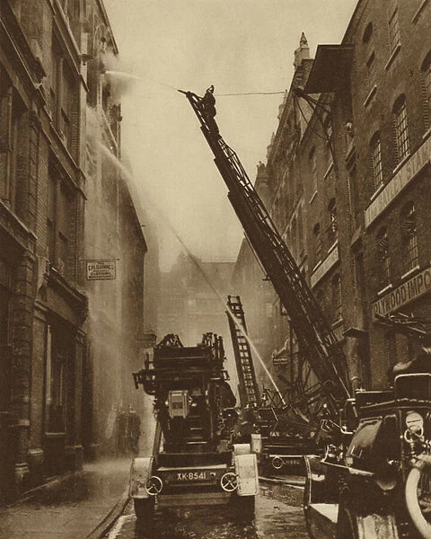 How the London Fire Brigade comes to grips with its enemy (b  /  w photo)