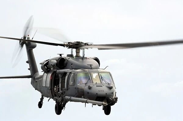 An HH-60 Pave Hawk helicopter conducts search and rescue operations