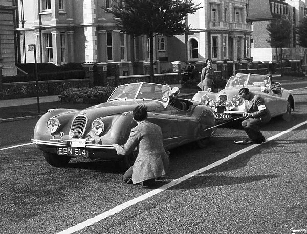 Officials measuring Jaguar XK120, 8 clubs rally Eastbourne 1952. Reg EBN 514. Creator: Unknown