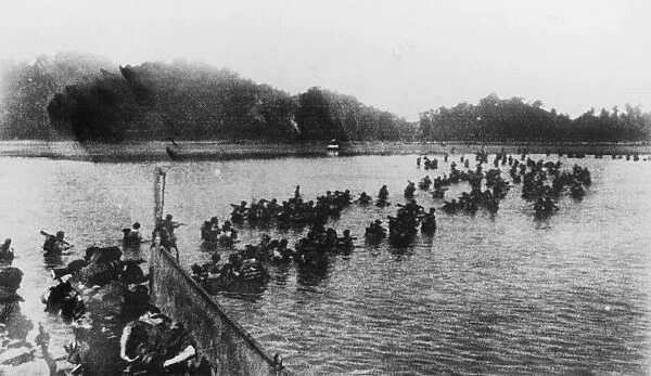 Arakan: The landing on Myebon, Hunters Bay. British Commandos wading ashore from a