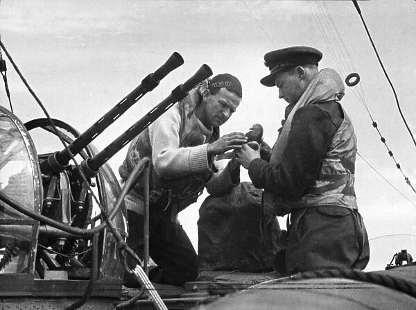 Captain of the HSL of the Air Sea Rescue Service, about to release a carrier pigeon now