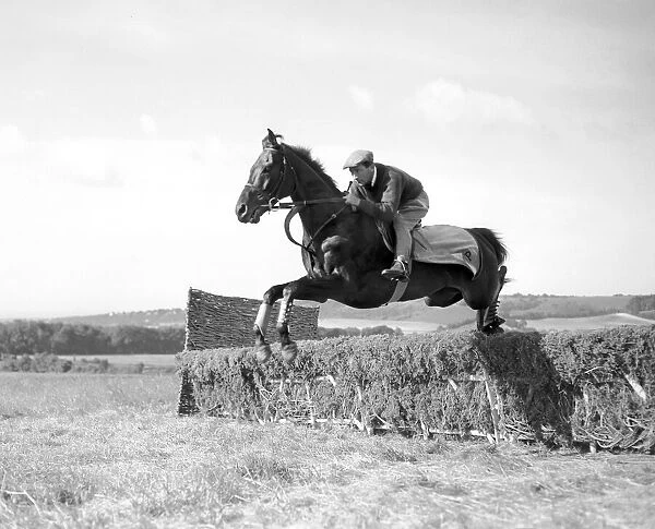 Jockey Fred Winter working out on the Downs. 15th July 1954
