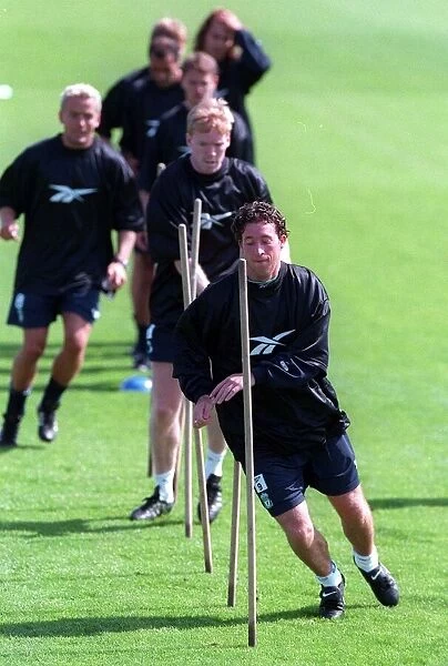 Robbie Fowler leads his teammates during a Liverpool training session