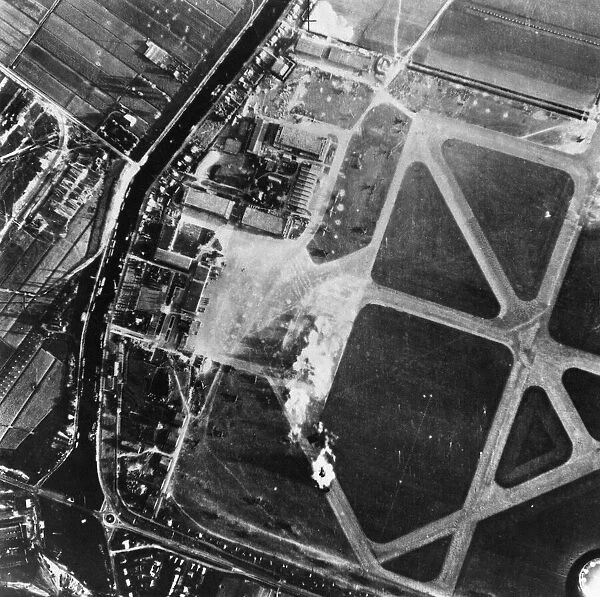 A salvo of bombs bursting on the concrete runway of Schipol Aerodrome, Amsterdam