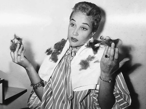 Sylvia Syms Actress having her hair trimmed - September 1959