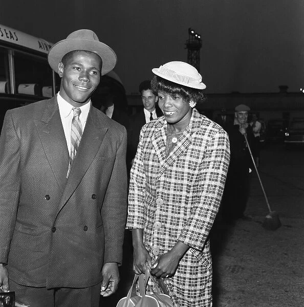 Two of the one hundred and two West Indians seen here arriving at Heathrow Airport