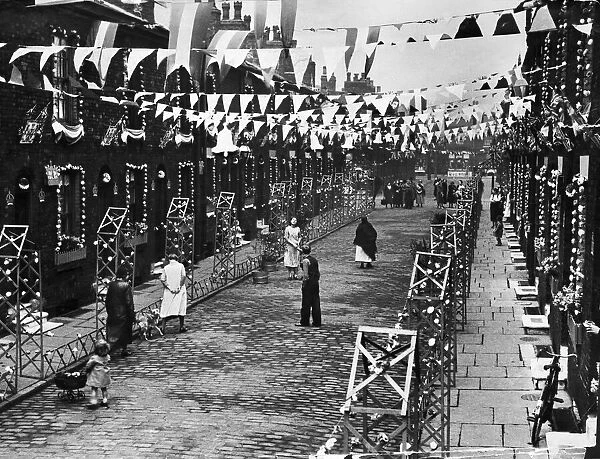 View of Gorse Street in Hulme, Manchester, decked out with flags