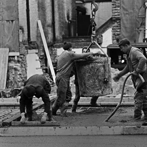 Building workers laying concrete, City of London