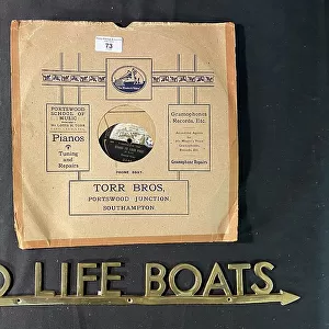 HMV 78rpm record, and brass To Life Boats sign
