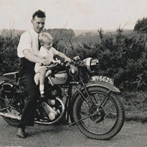 Man and little boy on 1933 Triumph motorcycle