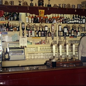 Pub bar and landlord, Walton-on-the-Naze, Essex