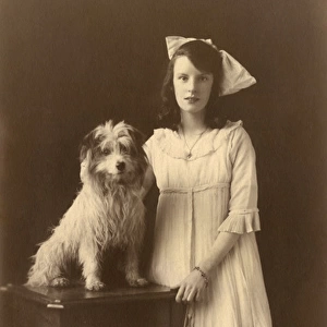 Studio portrait, girl with Yorkshire terrier