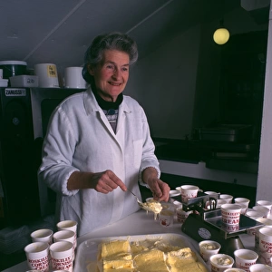 Woman serving Roskillys Cornish Clotted Cream