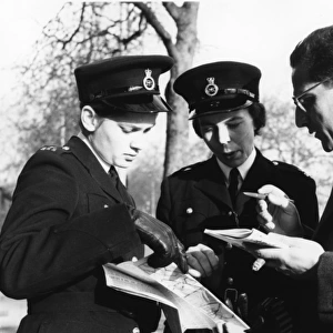 Two women police officers giving directions, London
