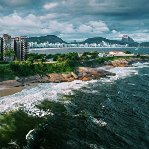 Aerial drone view of Arpoador section of Ipanema Beach with Copacabana and Sugarloaf Mountain visible in the background, Rio de Janeiro, Brazil, South America