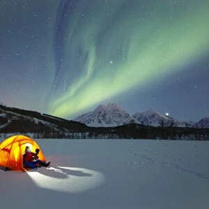 Europe, Norway, Troms: winter camping under the northern lights in the Lyngen Alps