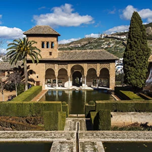 Portico and pool of the early 14th-century Palacio del Partal, Alhambra palace, Granada
