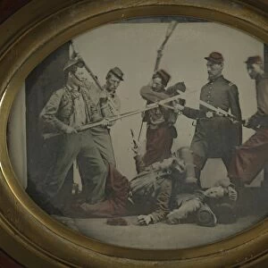 CIVIL WAR REENACTMENT. Men in Union Army uniforms reenacting a battle scene