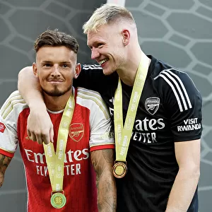 Arsenal's Ben White and Aaron Ramsdale Celebrate Penalty Shootout Victory in Community Shield Final (2023-24): Overcoming Manchester City at Wembley