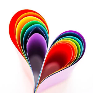 Curved colorful paper shaped like a heart