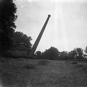 Chimney felling by gelignite at Bedfont Powder Mills, Hounslow. The chimney falling