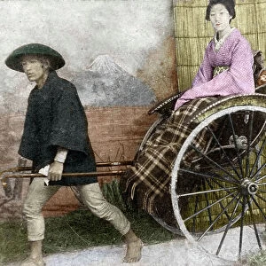 Geisha sitting on a rickshaw in Japan around 1900 (Japan: Geisha pulled in a rickshaw 1900 ca) Anonymous photography Private collection