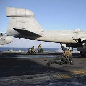 An EA-6B Prowler prepares to launch off the flight deck of USS Nimitz