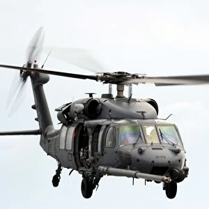 An HH-60 Pave Hawk helicopter conducts search and rescue operations