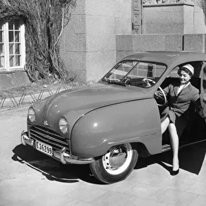 1954 Saab 92b with female model. Creator: Unknown