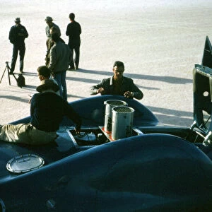 Mechanics working on Bluebird CN7 at lake Eyre for World Land speed record attempt, 1964