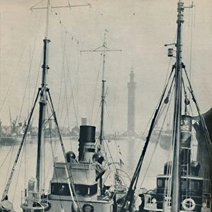 Naval Trawler, HMS Liffy alongside a Grimsby fishing vessel in Grimsby Docks, 1937