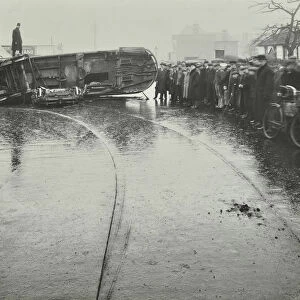 Overturned electric tram and onlookers, London, 1913