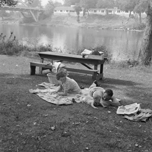 Sunday picnic in park on the Rogue River... Grants Pass, Josephine County, Oregon, 1939. Creator: Dorothea Lange