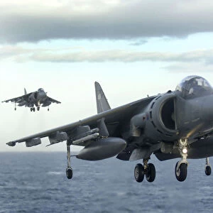 Two Harriers Landing