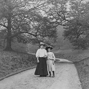 Victorian Lady And Child Walking In The Park Circa 1900