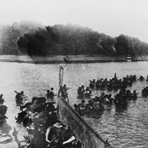 Arakan: The landing on Myebon, Hunters Bay. British Commandos wading ashore from a