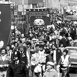 Behind their banners: Striking miners march through Port Talbot during 1984 / 85 dispute