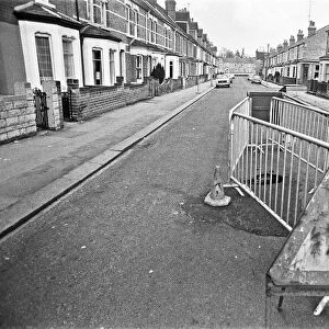 Barriers erected around a large hole in Norfolk Road, Reading, which suddenly appeared